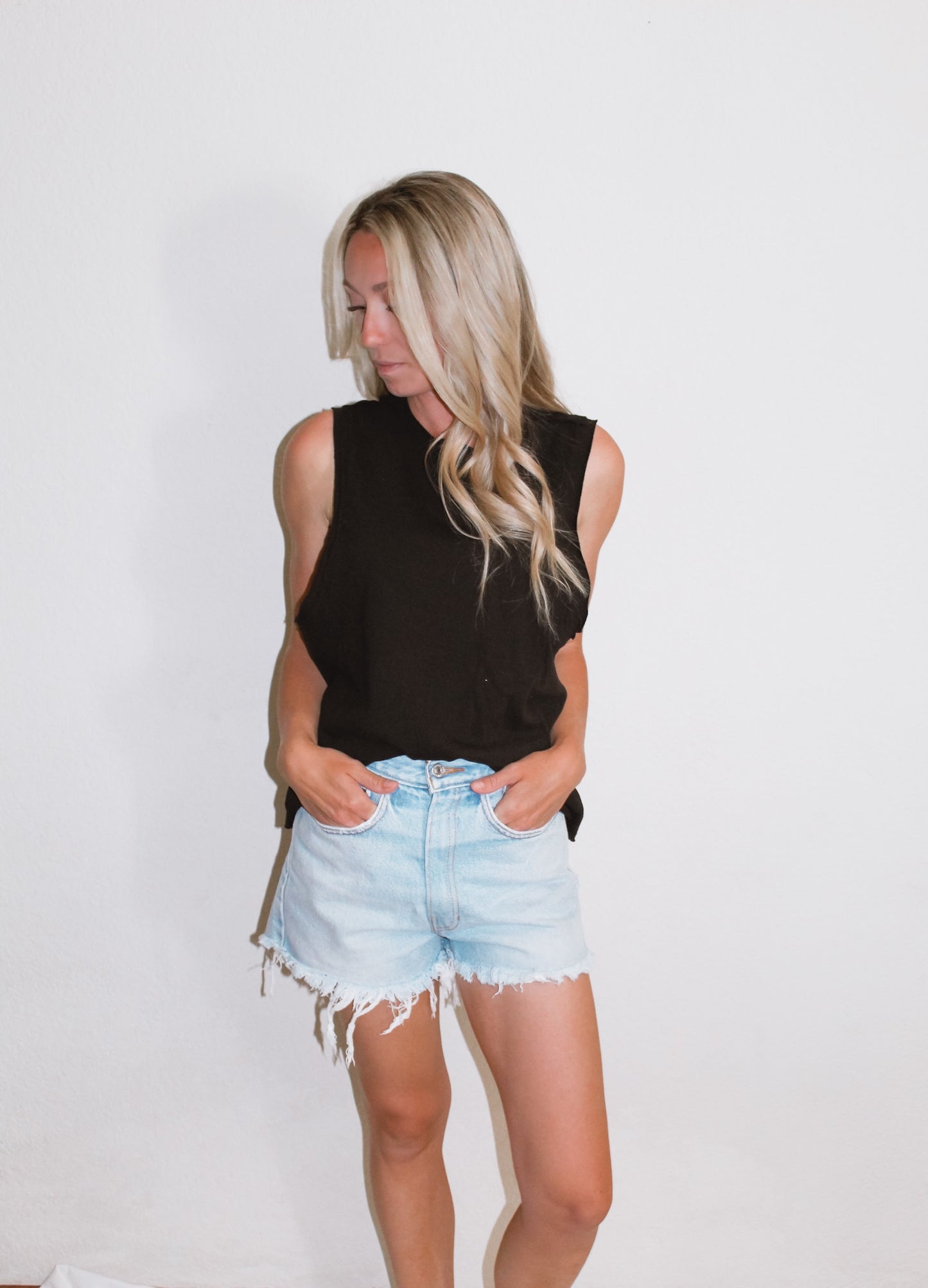 Raw hem sleeveless tank