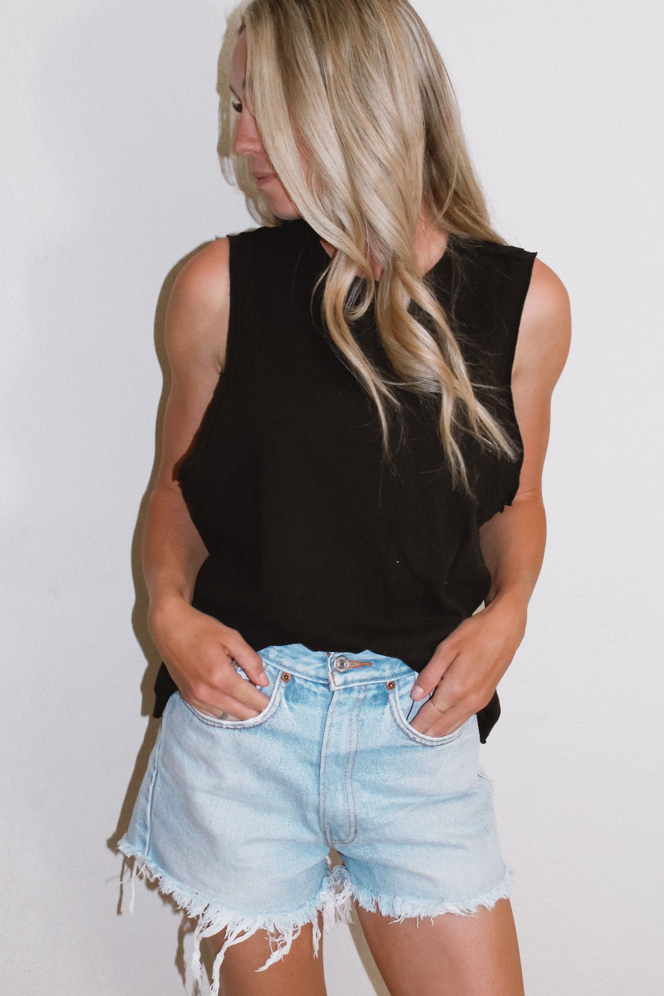 Raw hem sleeveless tank