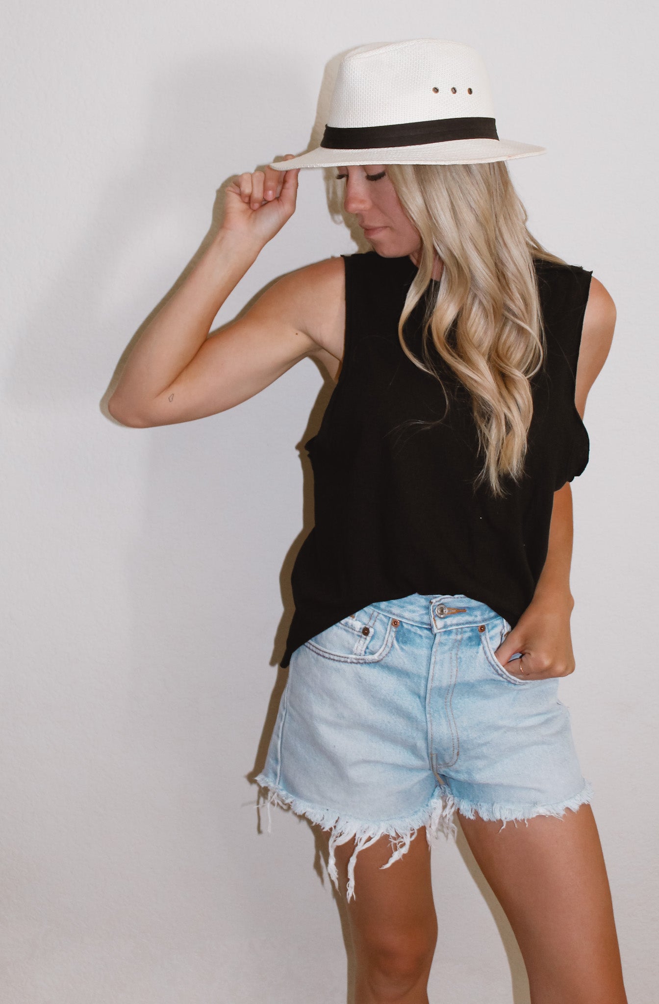 Raw hem sleeveless tank